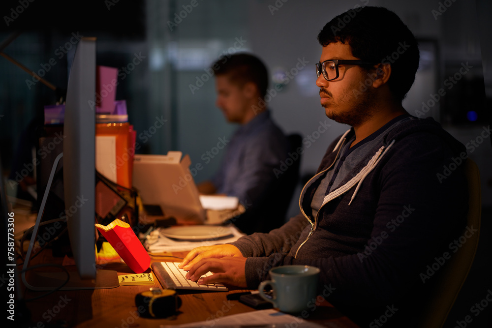 Poster Coding, computer and night with programmer man at desk in office for cyber security development. Fast food, programming and software with confident young game developer in workplace for overtime