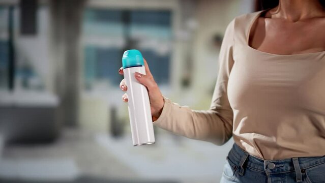 Woman Using Air Spray