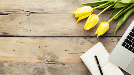 Bouquet of yellow tulips on a wooden background. Top view