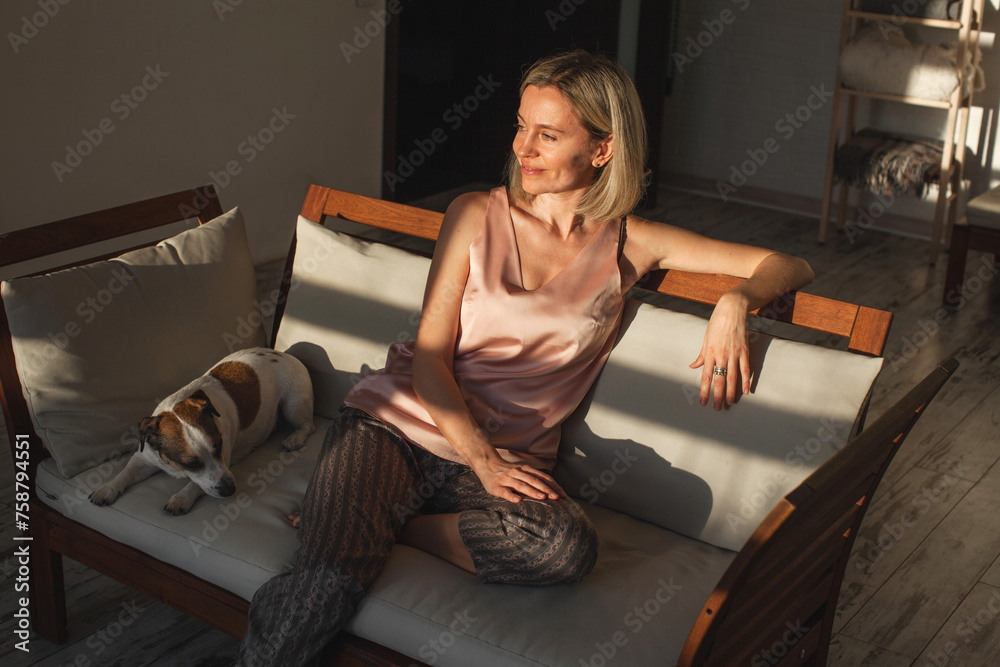 Poster Happy middle aged woman relaxing at home