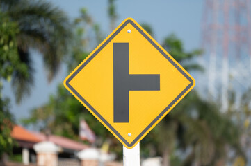Selective focus of Thailand T-junction left sign. 