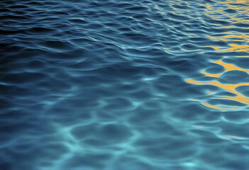 Obraz premium Transparent blue colored clear calm water surface texture stock photo