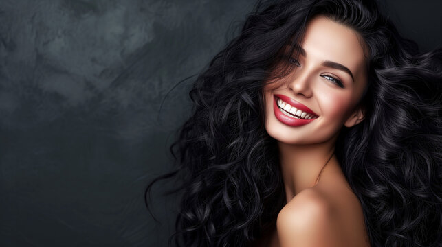 Beautiful laughing brunette model girl with long curly hair . Smiling woman.