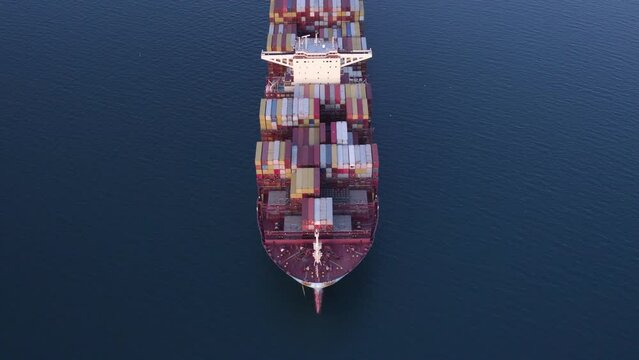 Aerial view of fully loaded container ship cruising open ocean sea for logistics import export, shipping or transportation, Mediterranean Sea, Croatia