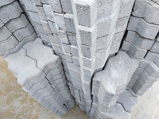 Many cement brick flooring are stacked in construction supply stores.