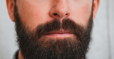 Obraz premium Close-up portrait of a stylish men's mustache and beard
