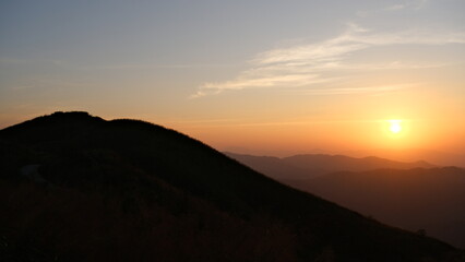 Sunset over the mountains in the evening.