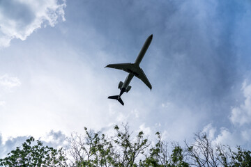 Underside view of airplane taking off