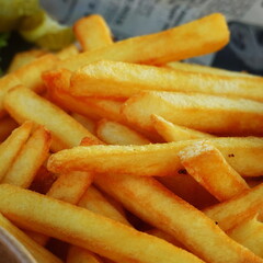 Golden French Fries Up Close, Crispy And Delicious