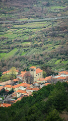 Fototapeta na wymiar View from the top of the church of a mountain village near Trieste on a cloudy day