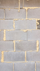 Obraz premium Espuma en pared de ladrillos de hormigón