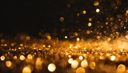 glowing golden bokeh particles on a black background abstract background with a combination of black and gold particles