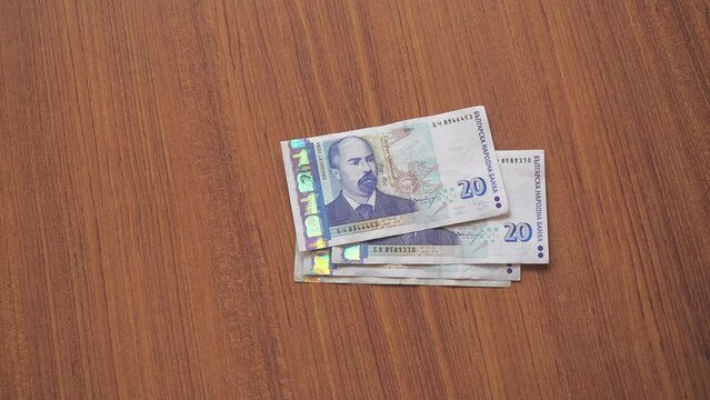 Female hands are laid out by Bulgarian levs