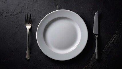 An empty plate with knife and fork on dark background 