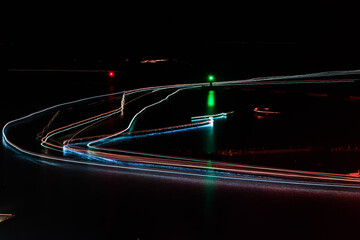 Light tracks of ships formed by fishing boats departing in succession from Nanfang'ao of northern...