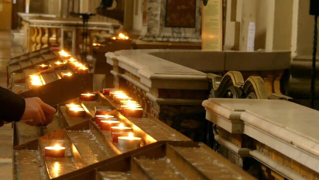 candles in Catholic church on stands