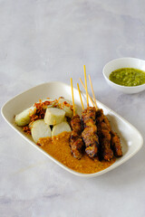 chicken satay and rice cake