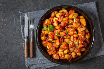 fried spanish potatoes with paprika sauce in bowl