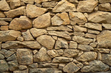 Old rural light stone wall closeup