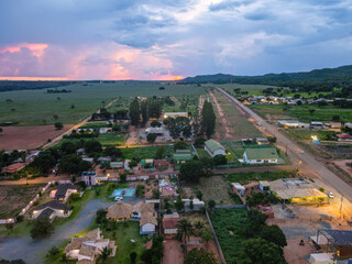 Fototapeta na wymiar Aerial landscape of rainforest and village during summer sunset in Nobres Bom Jardim Mato Grosso