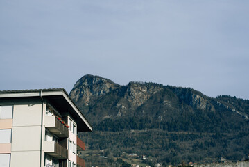 apartment building against the backdrop of mountains