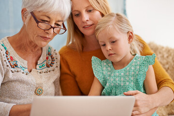 Family, laptop and internet at a home with grandmother, girl and mother together with game....