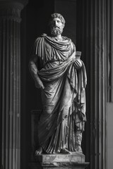 Mysterious ancient greek, roman male stoic statue, sculpture in dramatic lighting, shadows highlighting the impressive muscular build and classical beauty. 