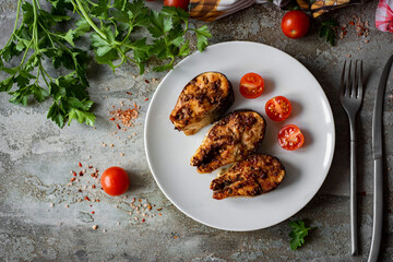 Dinner dish: Grilled fish steaks on a plate. Fried salmon steaks with spices on plates. View from above