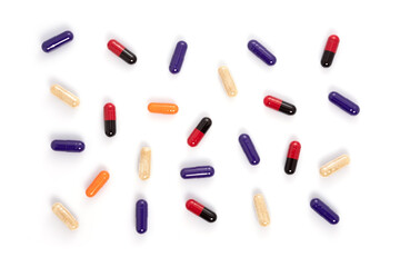 Creative layout of colorful pills and capsules on white background. Minimal medical concept.