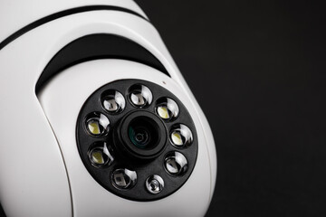 CCTV camera on dark background close up.