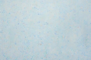 Gentle blue textured background with fine speckles.