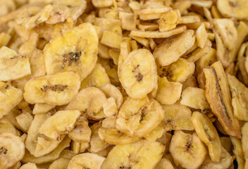 Image of dehydrated banana strips stocked in market for consumption.