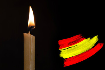 mourning candle burning front of flag Spain, memory of heroes served country, grief over loss,...