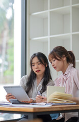 Two business people talk project strategy at office Businessman discuss project planning with colleague at modern workplace while having conversation and advice on financial data report