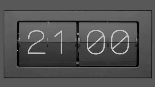 Flip clock quickly flips. Retro flip clock changing from 20:59 to 21:00. Slow motion. Close up. 