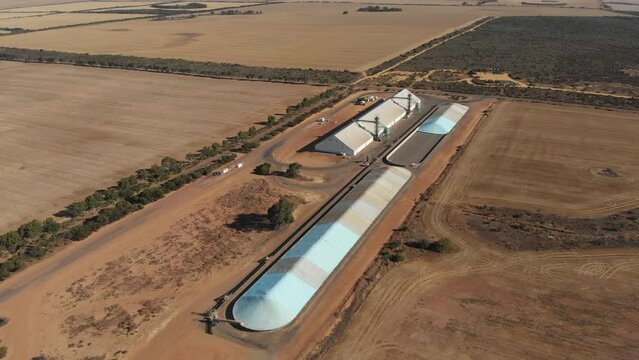 Aerial view of small site grain storage and bulkheads, Outback, Australia