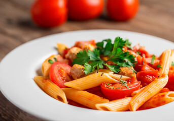 Penne pasta in tomato sauce with chicken