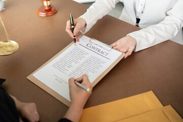 Lawyer office the company hired the lawyer office a legal advisor and draft the contract so that the client could signs contract. Contract of sale was on the table in the lawyer office 