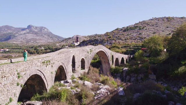 Aerial view of old ottoman mesi bridge over the Kir river, Shkoder, Albania