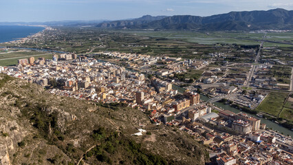 Panoramic view of the town of Cullera in the province of Valencia (Spain) with the river Turia that crosses it and the Municipal Natural Park 