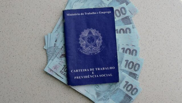 Brazilian Work ID with Brazilian banknotes: Work and money intertwine in this image, symbolizing prosperity and financial stability.