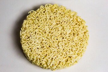 raw instant noodles on a white background