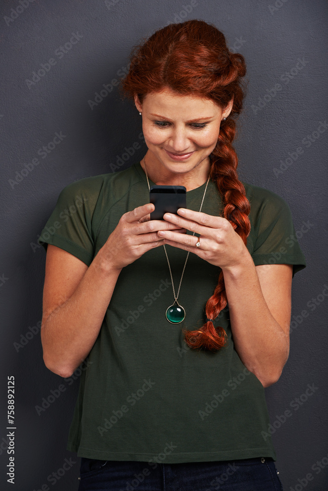 Poster smile, reading and woman in studio with phone for social media, online chat or networking. communica