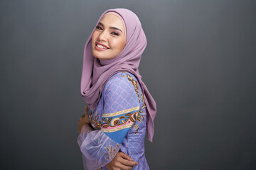 Beautiful female model wearing modern kebaya batik , an Asian traditional dress for Muslim woman...