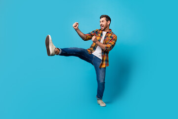 Full body photo of attractive young man fighter boxing practice wear trendy plaid clothes isolated...