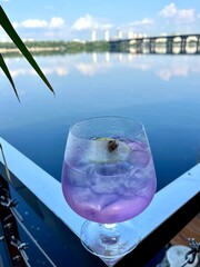glass of cocktail on the river