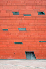 Architectural detail of red facade with windows, building exterior pattern - 758898193