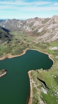 Aerial view of Somiedo, Spain with beautiful valley, lake, and mountain landscape, Valle de Lago, Asturias.