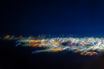 Flight take off landing airplane over city night abstract blurred.