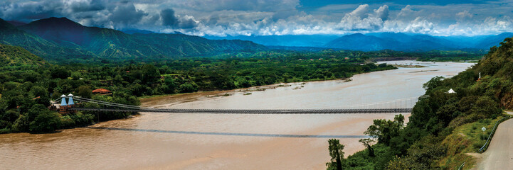 Fototapeta na wymiar Panoramic View of the Bridge of West in the Cauca River Antioquia Colombia
